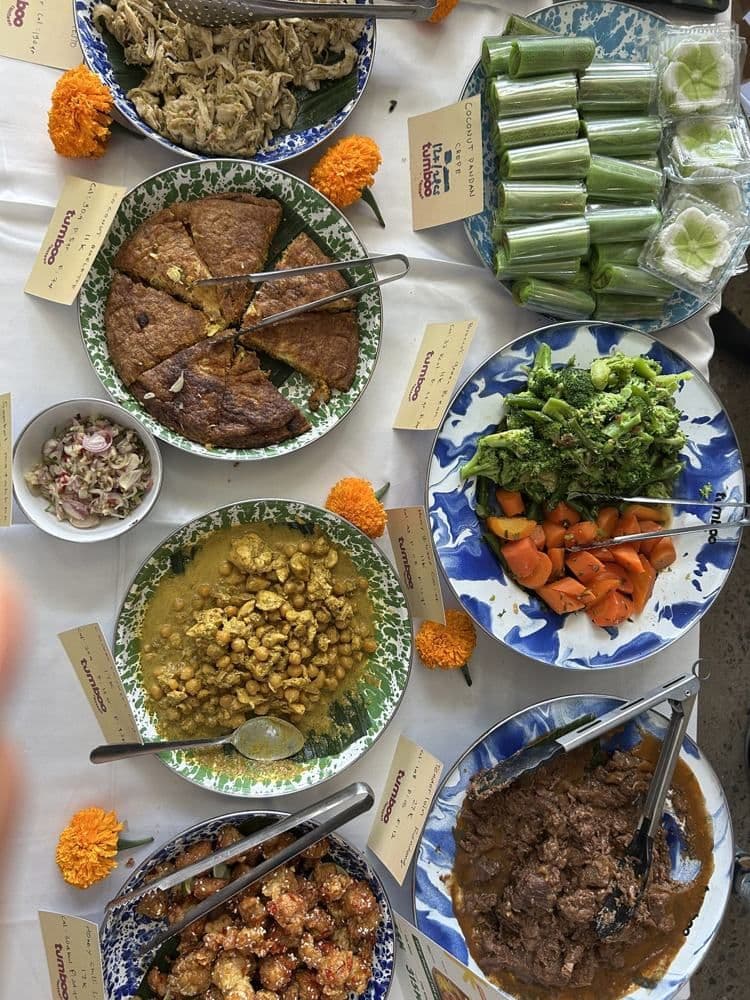 Nasi campur spread with marigolds